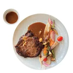 Thực đơn nhà hàng Chạm Bistro Garden M1. GRILLED RIBEYE STEAK A symphony of sizzling steak with grilled vegetables / Bò thăn lưng nướng